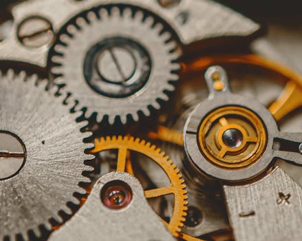 A detailed macro shot of metal gears and cogs showcasing engineering precision and mechanical art.