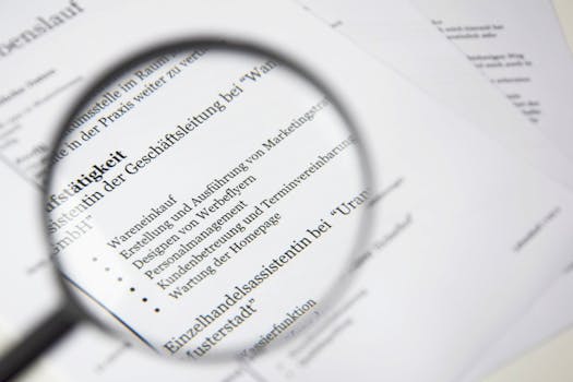 Close-up of a business document text under a magnifying glass.